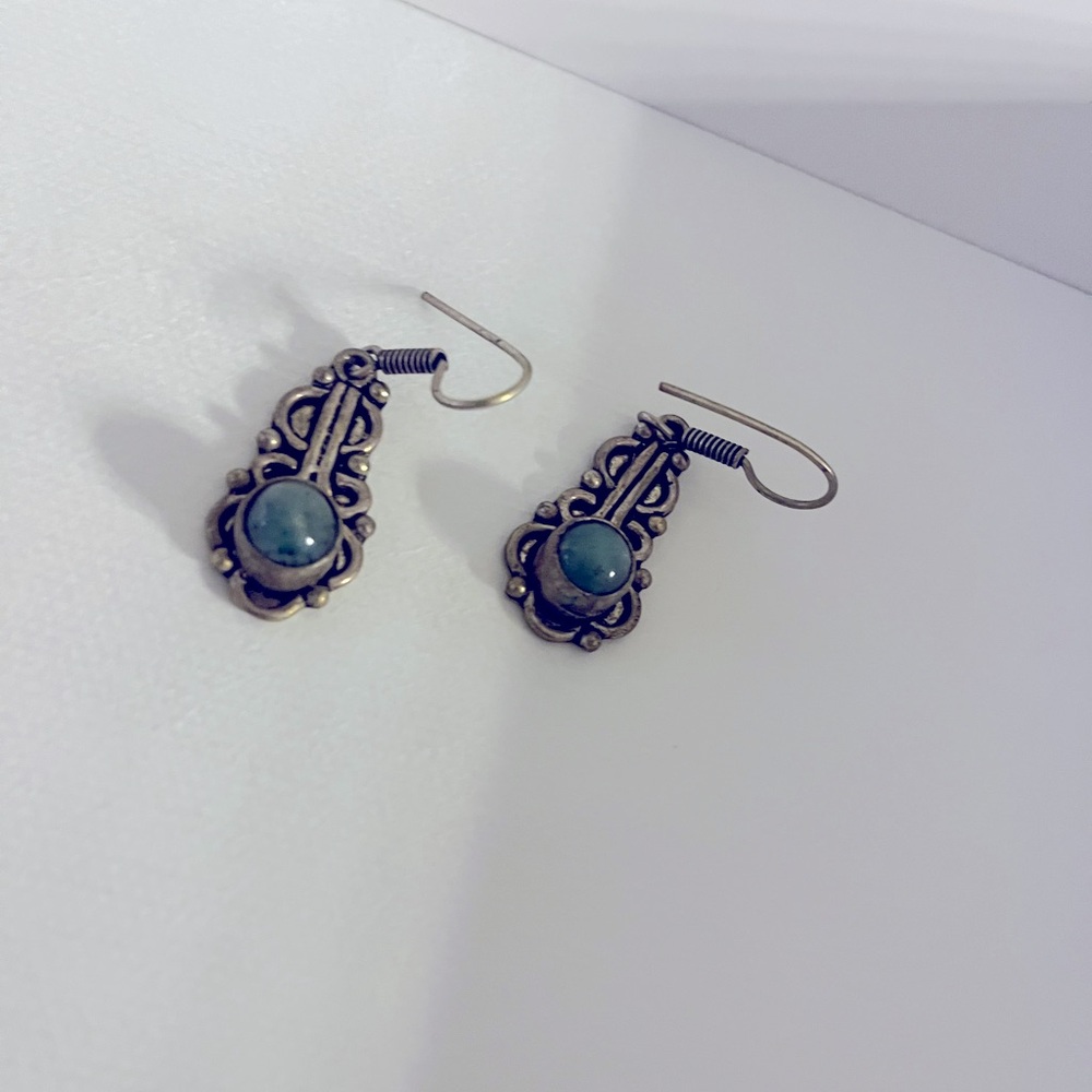 Gorgeous dangling earrings from Morocco with a turquoise stone. Sterling silver.